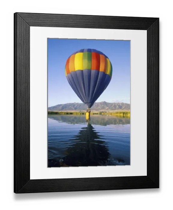 Framed Print : USA, Utah, Cache Valley. Basket of hot air balloon intentionally touches water of Framed Print : USA, Utah, Cache Valley. Basket of hot air balloon intentionally touches water of