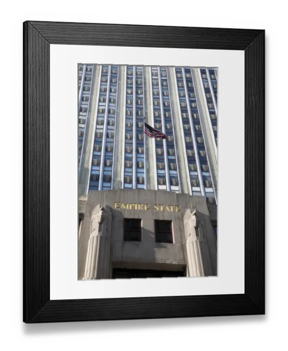 Framed Print : New York, NY, USA - An American flag is flying above the entrance to the Empire State Framed Print : New York, NY, USA - An American flag is flying above the entrance to the Empire State
