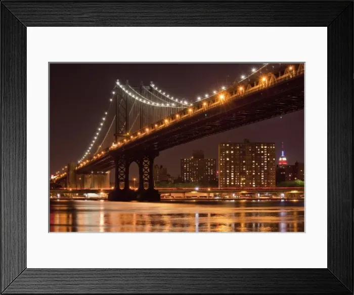 Framed Print : USA, New York, Brooklyn, Manhattan Bridge at night reflected in East River with Empire