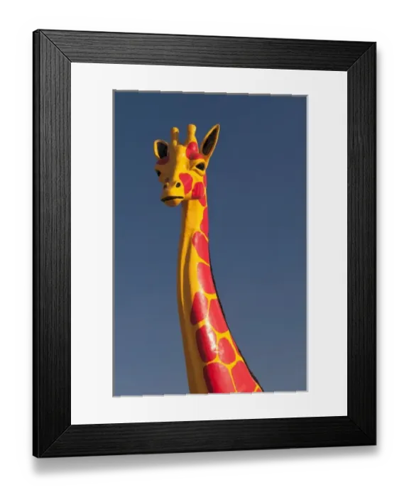 Framed Print : South Carolina, USA. A colorful Giraffee sculpture at the Mexican themed South of Framed Print : South Carolina, USA. A colorful Giraffee sculpture at the Mexican themed South of