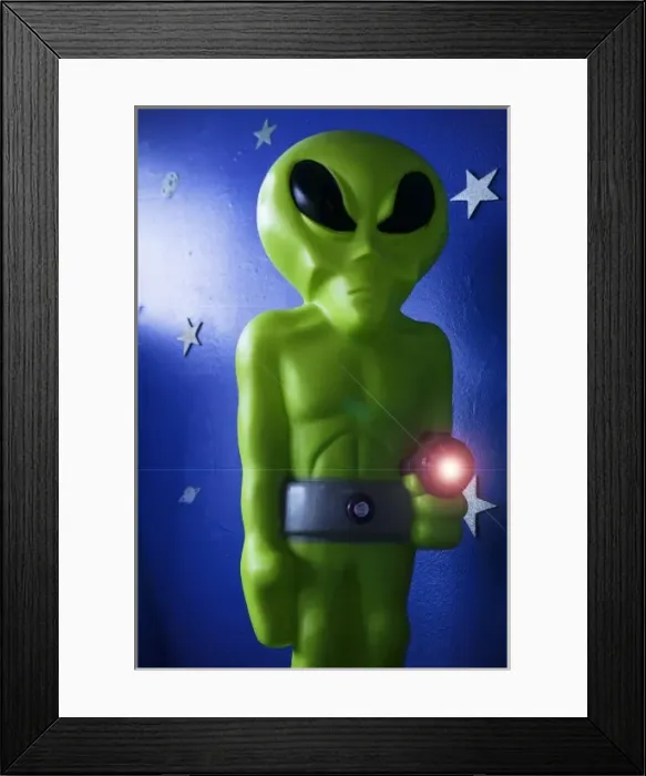 Framed Print : Roswell, New Mexico, United States. Green alien with ray run for sale in local store Framed Print : Roswell, New Mexico, United States. Green alien with ray run for sale in local store