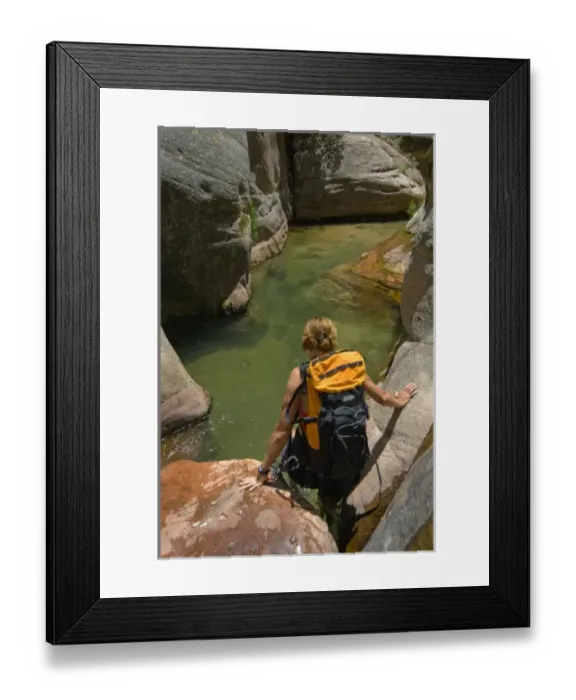 Framed Print : USA, Utah, Zion National Park. A female canyoneer in the Subway. (MR)