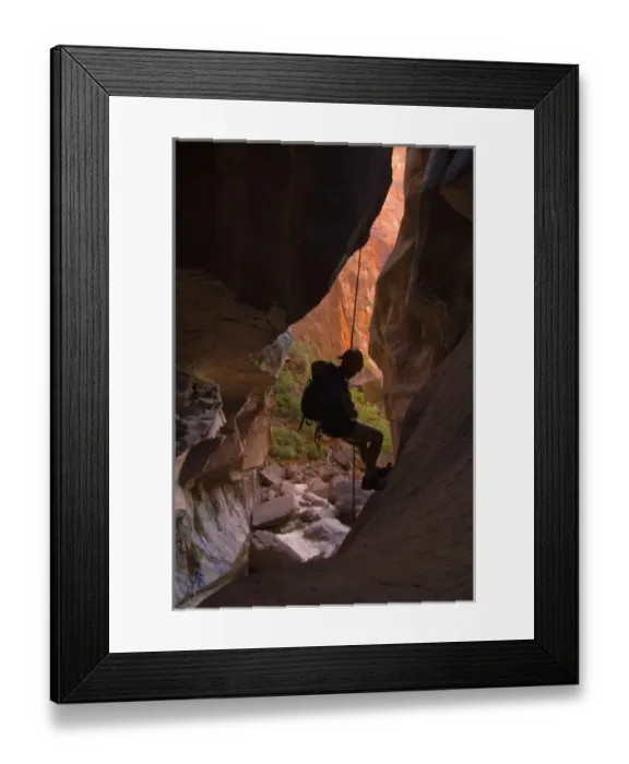 Framed Print : USA, Utah, Zion National Park. A female canyoneer rappels in Pine Creek slot canyon. (MR) Framed Print : USA, Utah, Zion National Park. A female canyoneer rappels in Pine Creek slot canyon. (MR)