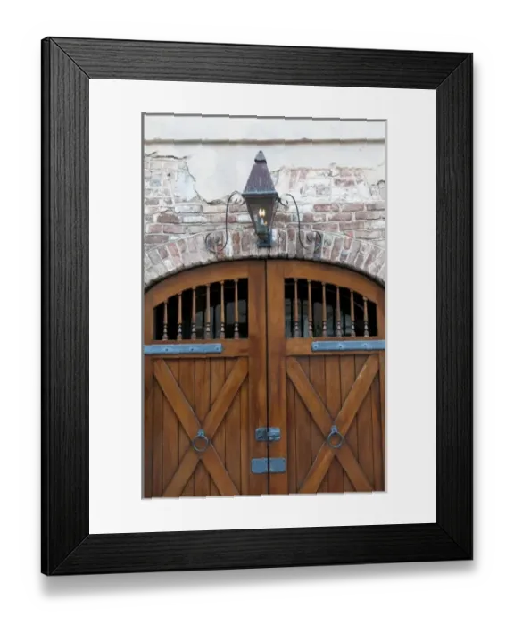 Framed Print : Charleston, South Carolina, USA. Wooden door and historic brick building in downtown Framed Print : Charleston, South Carolina, USA. Wooden door and historic brick building in downtown