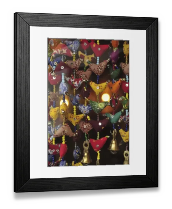 Framed Print : USA, Oregon, Portland. Fabric mobiles with brass bells imported from India at gift shop