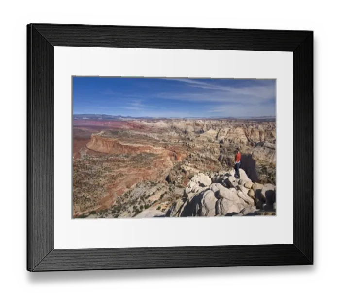 Framed Print : USA, Utah, Capitol Reef National Park. A female hiker on the summit of Ferns Nipple