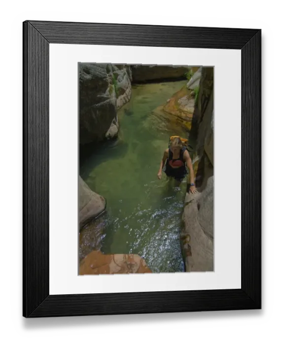 Framed Print : USA, Utah, Zion National Park. A female canyoneer in the Subway. (MR)