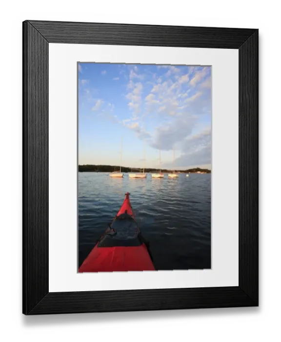 Framed Print : The bow of a kayak and moored sailboats in Portsmouth Harbor in Portsmouth, New Hampshire Framed Print : The bow of a kayak and moored sailboats in Portsmouth Harbor in Portsmouth, New Hampshire