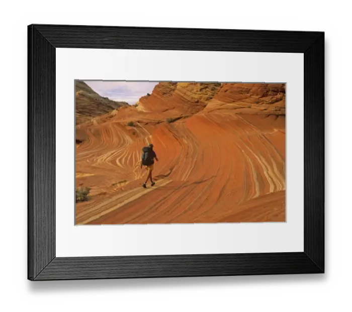 Framed Print : Backpacker at Coyote Buttes in the Paria Vermillion Cliffs Wilderness Area at the Utah
