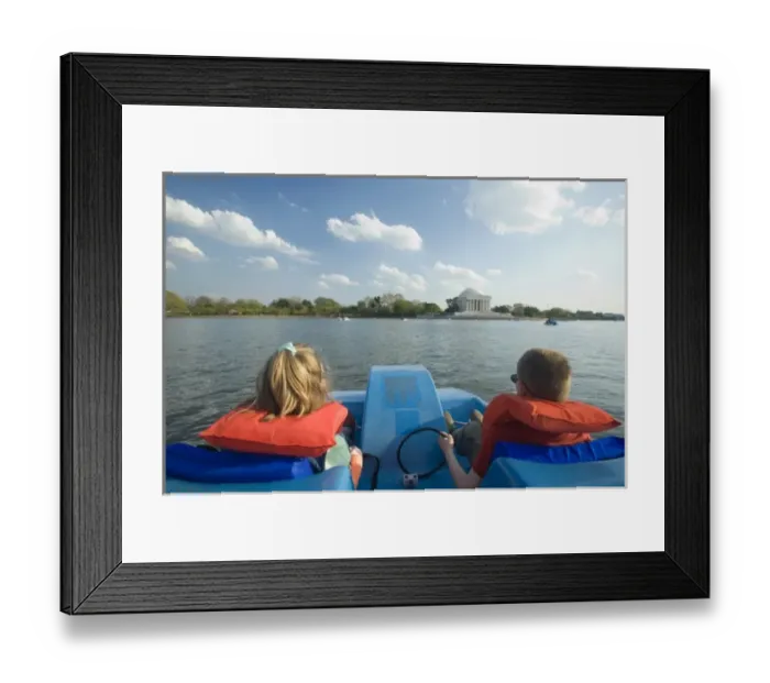 Framed Print : Boy (age 8) and girl (age 6) on paddleboat in lake near Jefferson Memorial, Washington D