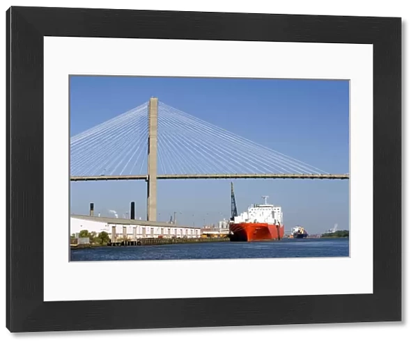 Container ships pass under the Talmadge Memorial Bridge on the Savannah River at