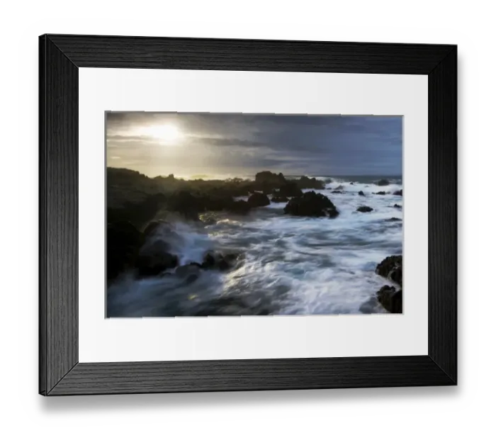 Framed Print : The sun breaks through storm clouds along the California Coast as surf breaks Framed Print : The sun breaks through storm clouds along the California Coast as surf breaks