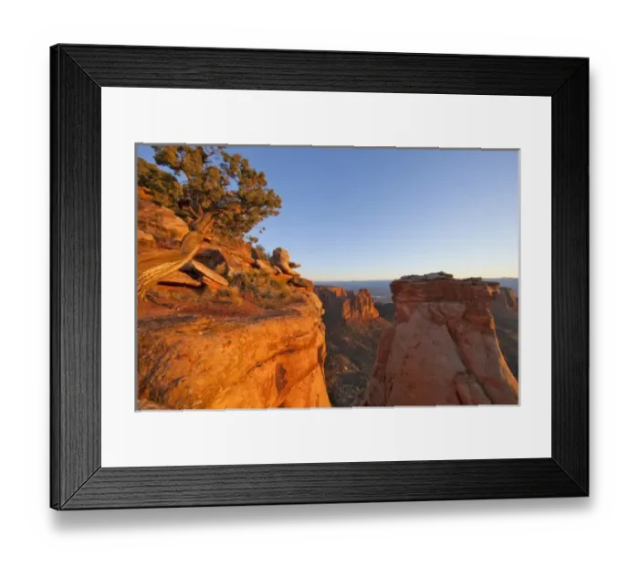 Framed Print : Cliffs of the Colorado National Monument catch mornings first light near Fruita, Colorado