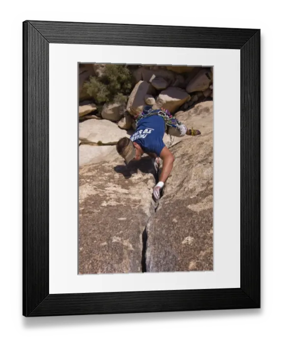 Framed Print : USA, California, Joshua Tree National Park. A rock climber on one of the parks many climbs