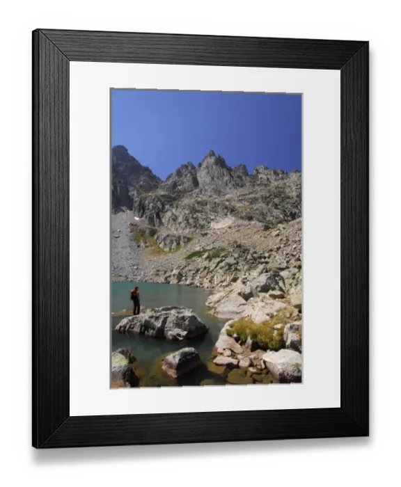 Framed Print : USA, Colorado, Rocky Mountains, Indian Peaks Wilderness. A female hiker at a mountain Framed Print : USA, Colorado, Rocky Mountains, Indian Peaks Wilderness. A female hiker at a mountain