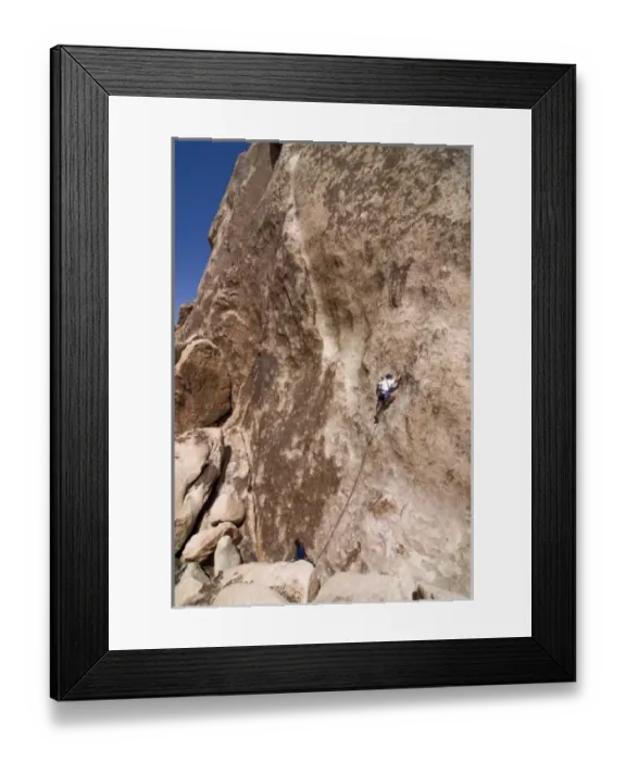 Framed Print : USA, California, Joshua Tree National Park. A rock climber on one of the parks many climbs