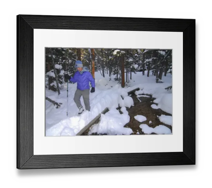 Framed Print : USA, Colorado, Rocky Mountain NP. A female hiker on a footpath covered by snow. (MR)