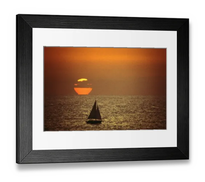 Framed Print : A sailboat at sunset in California