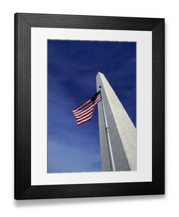 Framed Print : USA, District of Columbia. Against a deep blue sky, an American flag waves before Framed Print : USA, District of Columbia. Against a deep blue sky, an American flag waves before