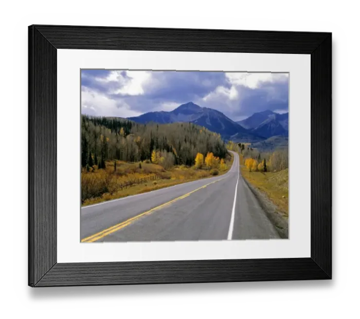 Framed Print : USA, Colorado, San Juan Mountains. A Colorado mountain highway in autumn beckons the driver farther