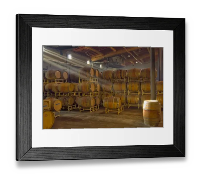 Framed Print : Shafts of light in barrel room of Montevina Winery. Established in 1970, bought by Framed Print : Shafts of light in barrel room of Montevina Winery. Established in 1970, bought by