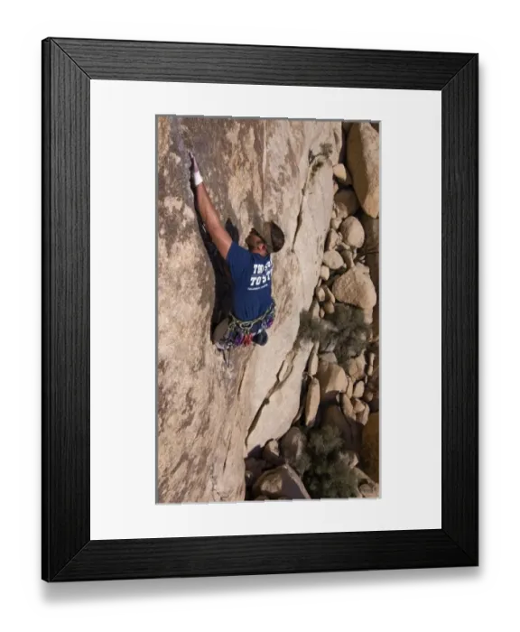 Framed Print : USA, California, Joshua Tree National Park. A rock climber on one of the parks many climbs