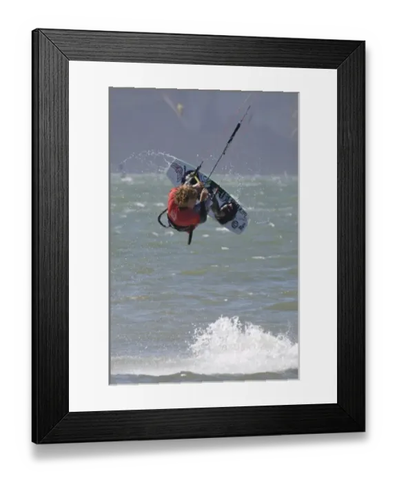Framed Print : USA, California, San Francisco. Jon Modica spins in the air while kiteboarding