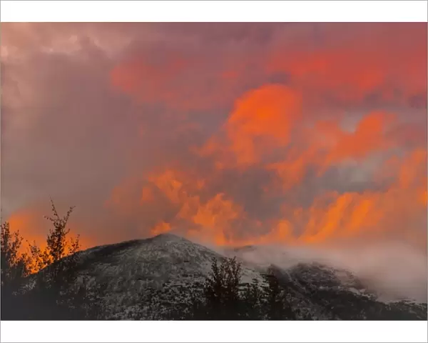 USA, Colorado, Frisco. Sunset illumines clouds over Buffalo Mountain