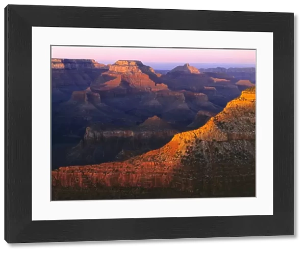 USA, Arizona, Grand Canyon NP. The last light of day catches the tops of the mesas at Mather Point