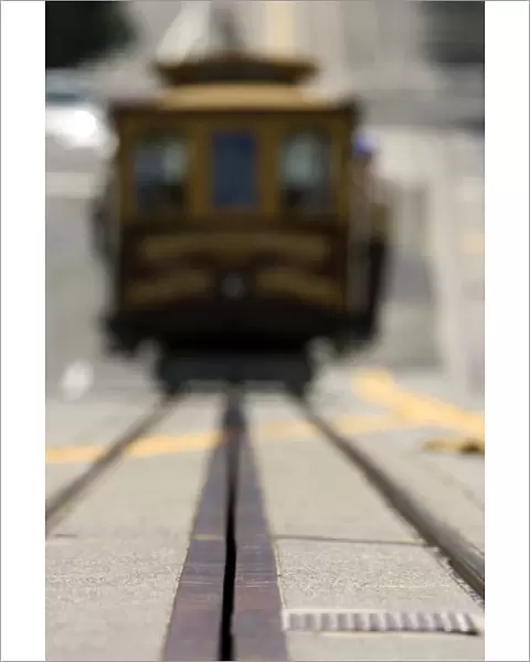 Ground level view of an approaching San Francisco cable car