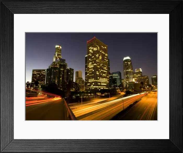Framed Print : First light from sunrise illuminates downtown Los Angeles wih traffic streaking across Framed Print : First light from sunrise illuminates downtown Los Angeles wih traffic streaking across