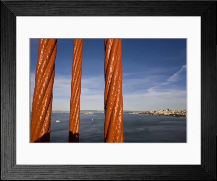 Framed Print : San Francisco and Alcatraz Island as seen through the cables of the Golden Gate Bridge