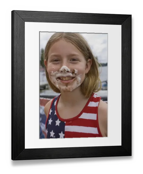 Framed Print : United States, Washington, Black Diamond, Girl (age 7) with pie on face, in American flag shirt Framed Print : United States, Washington, Black Diamond, Girl (age 7) with pie on face, in American flag shirt