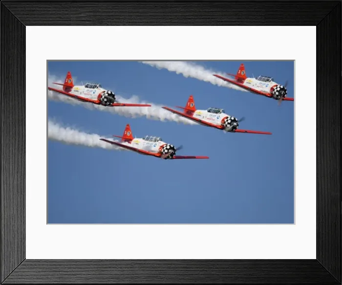 Framed Print : Aero Shell Aerobatic Team in T-6 Texans and is trailing smoke in the sky Framed Print : Aero Shell Aerobatic Team in T-6 Texans and is trailing smoke in the sky