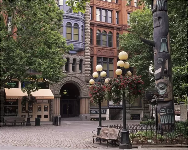 WA, Seattle, Totem pole and Pioneer Building at historic Pioneer Square