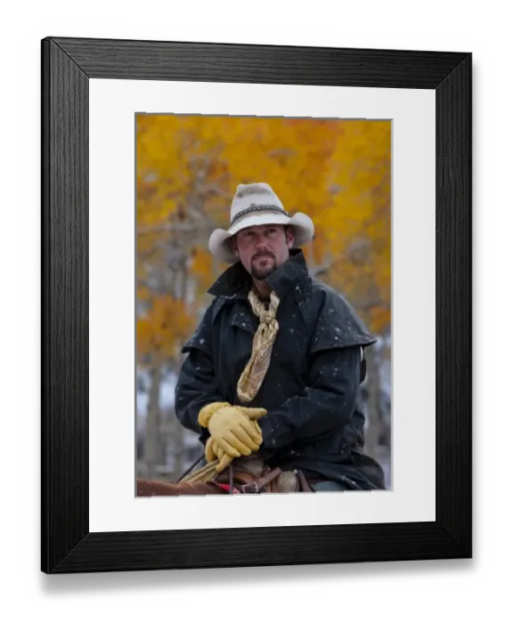 Framed Print : A cowboy sitting on her horse in a fall landscape of Shell Wyoming in the Big Horn