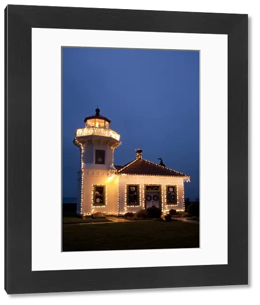 USA, Washington, Mukilteo. Mukilteo Lighthouse with holiday lights. Constructed in 1906