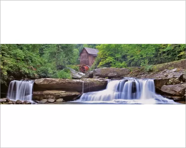 USA, West Virginia, Babcock SP. Two waterfalls form the foreground for Glade Creek Grist Mill