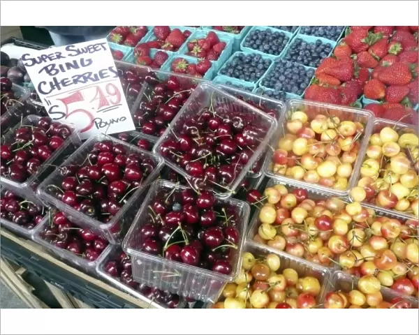 USA, Washington, Seattle. Locally grown cherries and berries at Pike Place Market