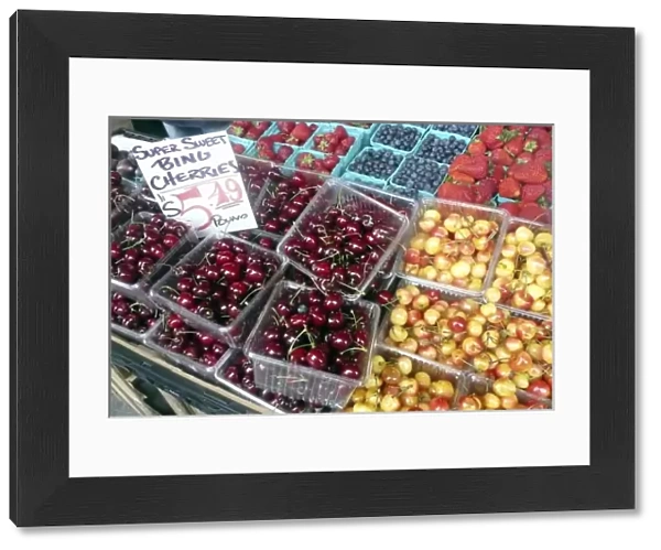 USA, Washington, Seattle. Locally grown cherries and berries at Pike Place Market