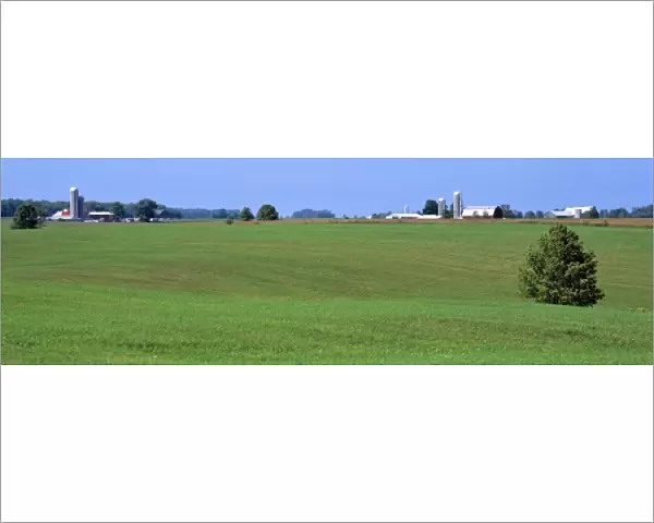 USA, Wisconsin, Kewaunee Co. Silos mark farm sites in rural Wisconsins Kewaunee County