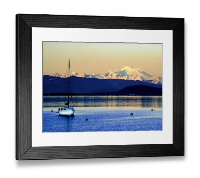 Framed Print : Sailboat anchored on Camano Island is swarfed by Mt. Baker