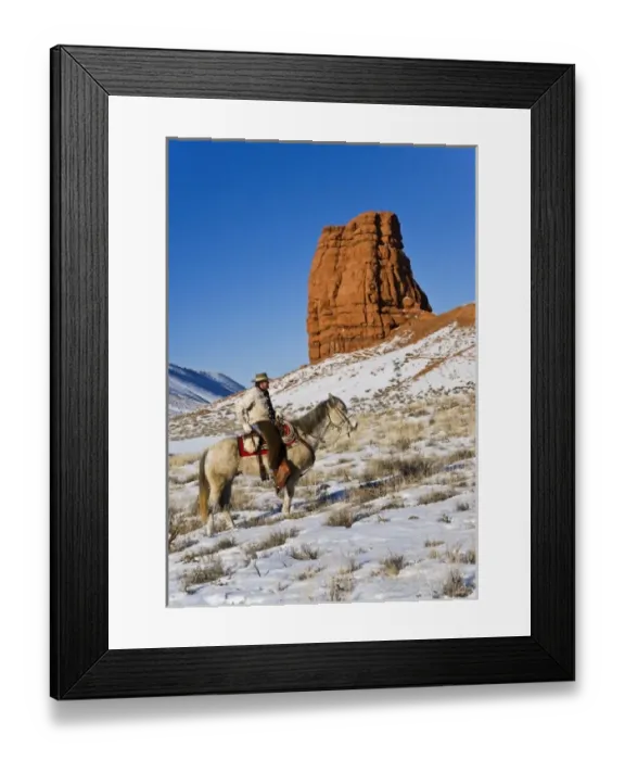 Framed Print : Cowboy with horses on the range on The Hideout Ranch in Shell Wyoming Framed Print : Cowboy with horses on the range on The Hideout Ranch in Shell Wyoming