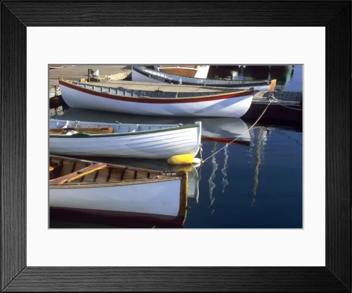 Framed Print : Wooden boats await a day on the water