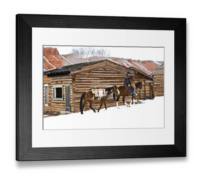 Framed Print : Cowboy riding a horse with a pack horse on The Hideout Ranch in Shell Wyoming Framed Print : Cowboy riding a horse with a pack horse on The Hideout Ranch in Shell Wyoming