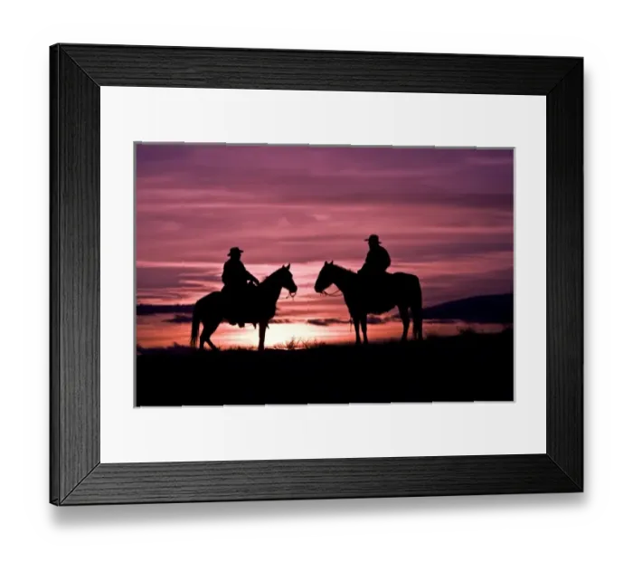 Framed Print : A silhouette of two cowboys on horses with the winter sky on The Hideout Ranch in Shell Wyoming Framed Print : A silhouette of two cowboys on horses with the winter sky on The Hideout Ranch in Shell Wyoming