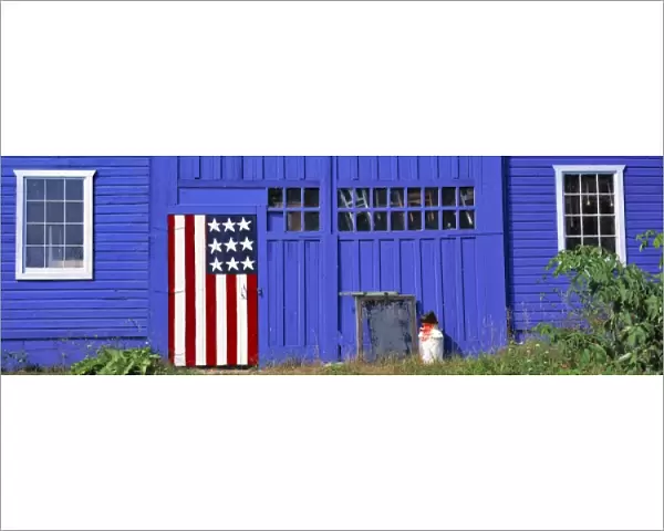 USA, Wisconsin, Kewaunee Co. A stylized American flag decorates a door on this blue