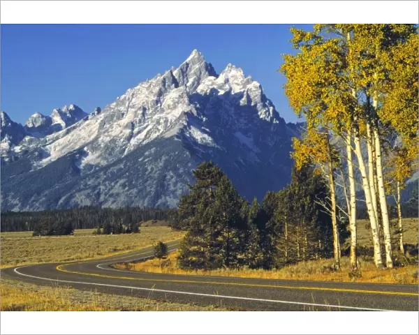 USA, Wyoming, Grand Teton NP. Teton Parkway winds below the magestic mountains of