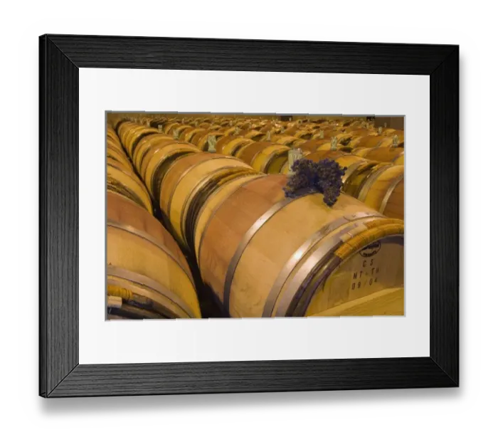 Framed Print : USA, Washington, Paterson. A bunch of grapes sit on an oak barrel at Columbia Crest Winery Framed Print : USA, Washington, Paterson. A bunch of grapes sit on an oak barrel at Columbia Crest Winery