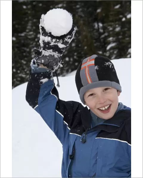 United States, Washington, boy (age 10) with snowball on Crystal Mountain (MR)
